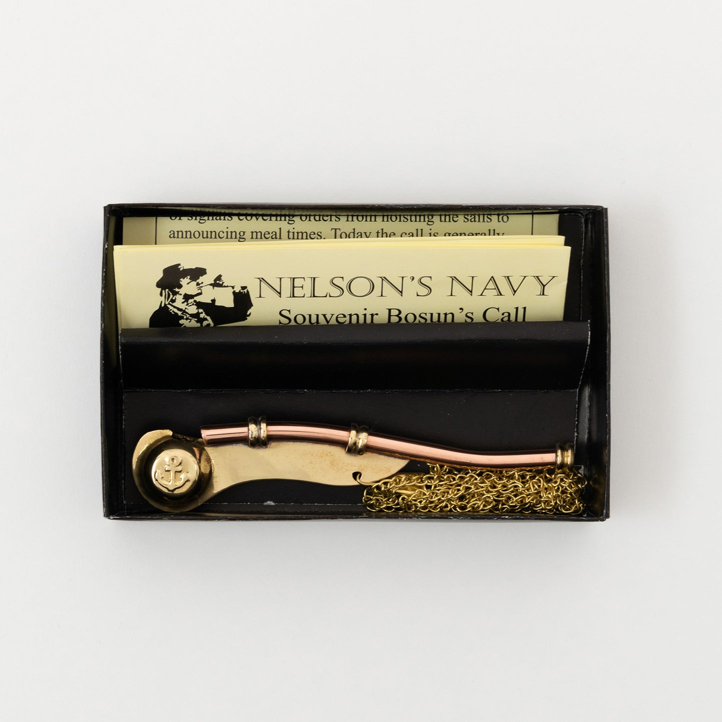 A replica bosun's call comes with a matching 50-inch neck chain and swivel snap-hook. Pictured in a black presentation box and on a white background.