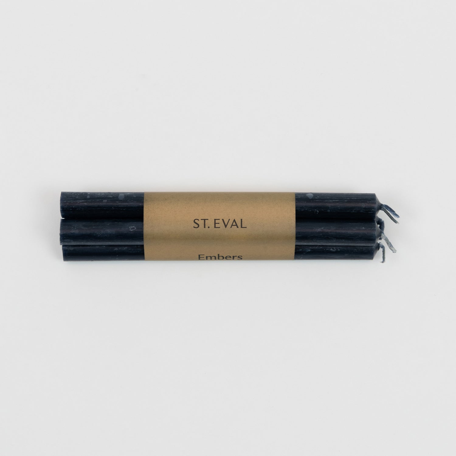 St Eval Embers Bundle of 4 candles wrapped in plain earthy card with St Eval, Embers. Long thin black candles with wicks.