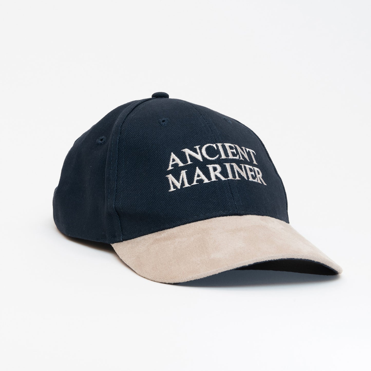 A black cap with a beige peak, with the words 'Ancient Mariner' displayed on the front.
