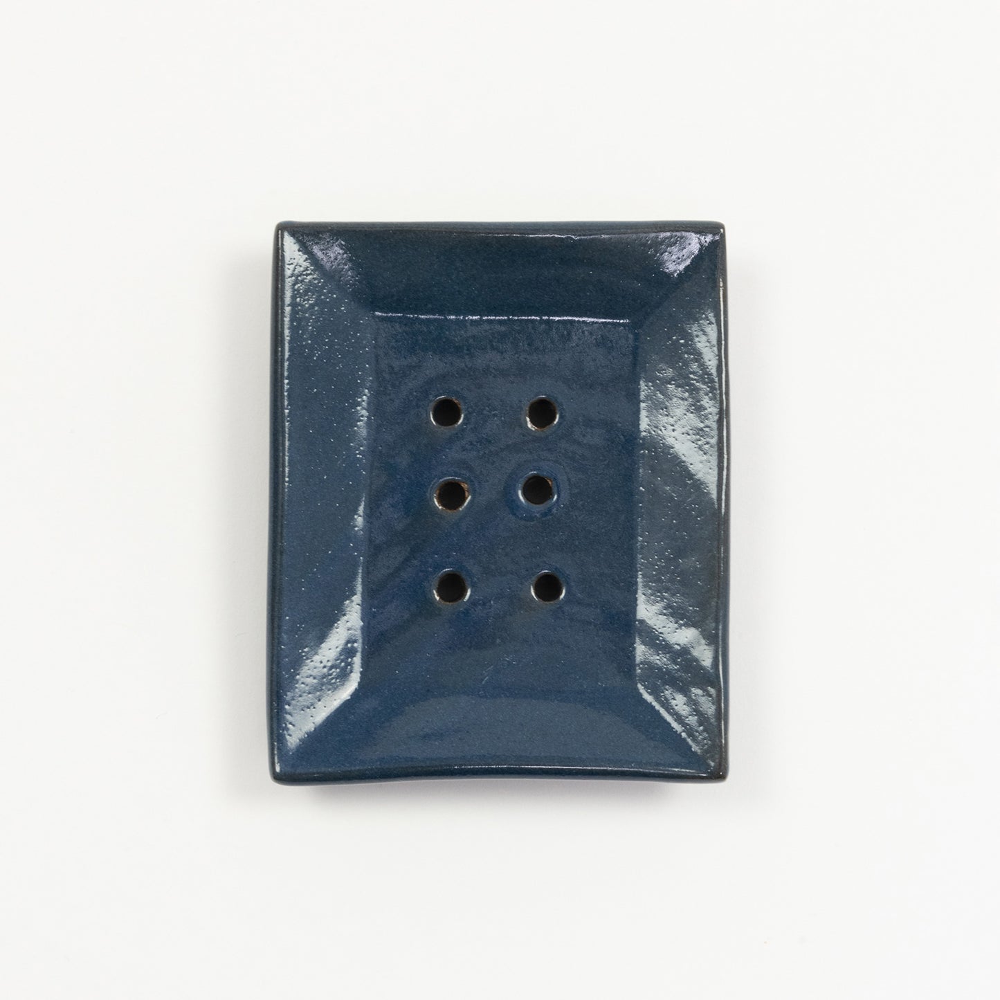 A cobalt blue stoneware soap dish pictured on a white background.