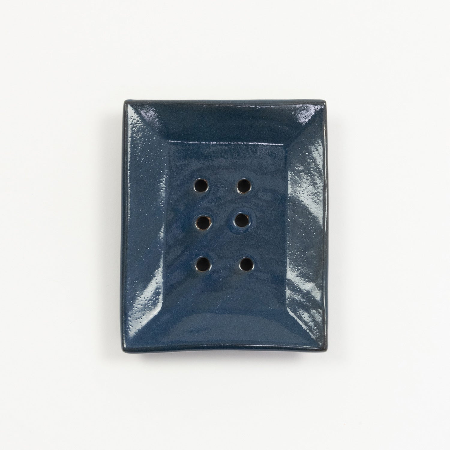 A cobalt blue stoneware soap dish pictured on a white background.