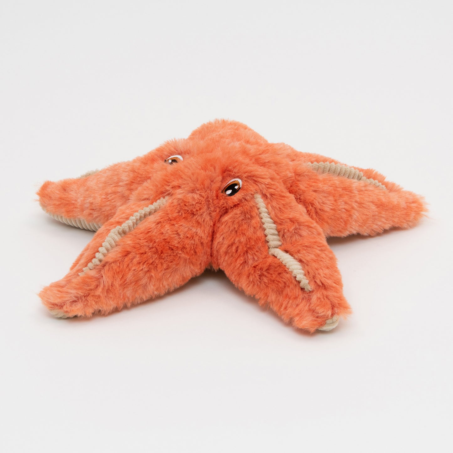 An orange plush starfish soft toy on a white background.