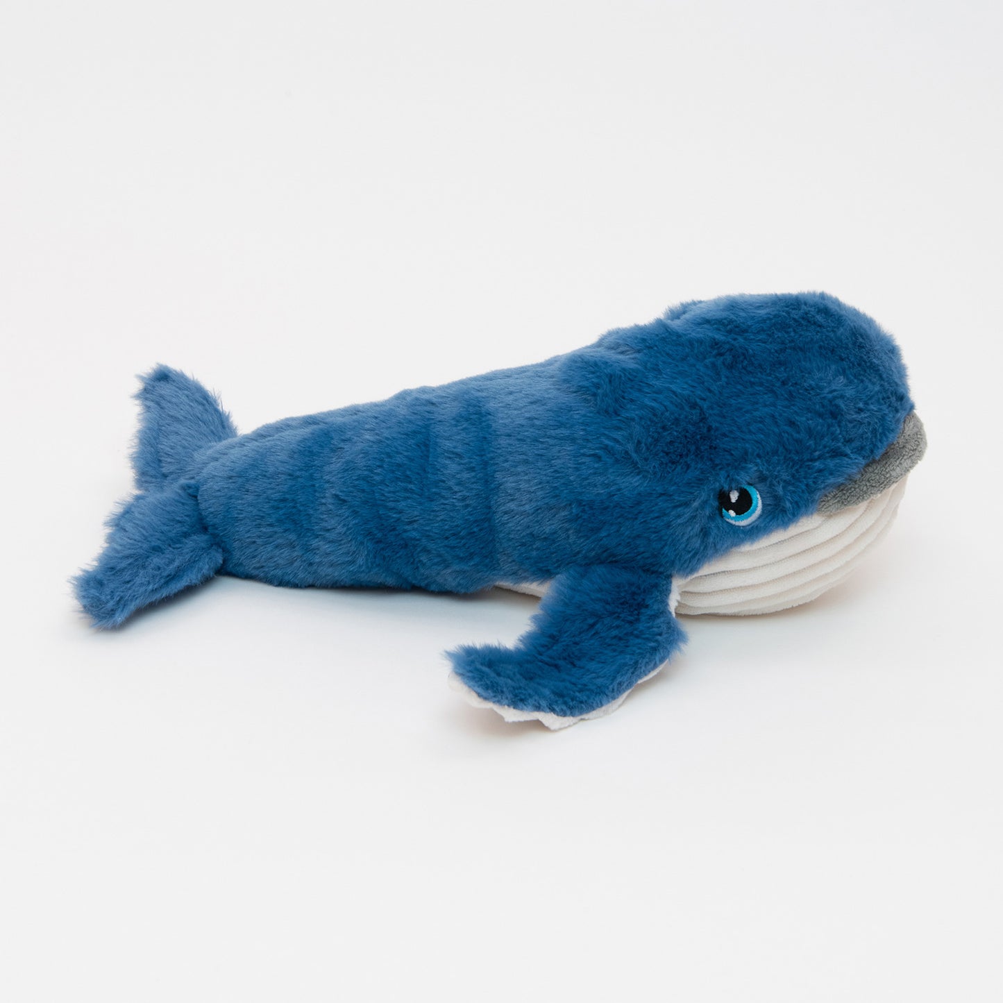 A blue and white plush whale soft toy, pictured on a white background.