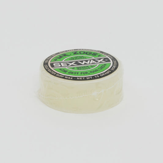 Image shows a clear disc of surfboard wax with green Sex Wax branding