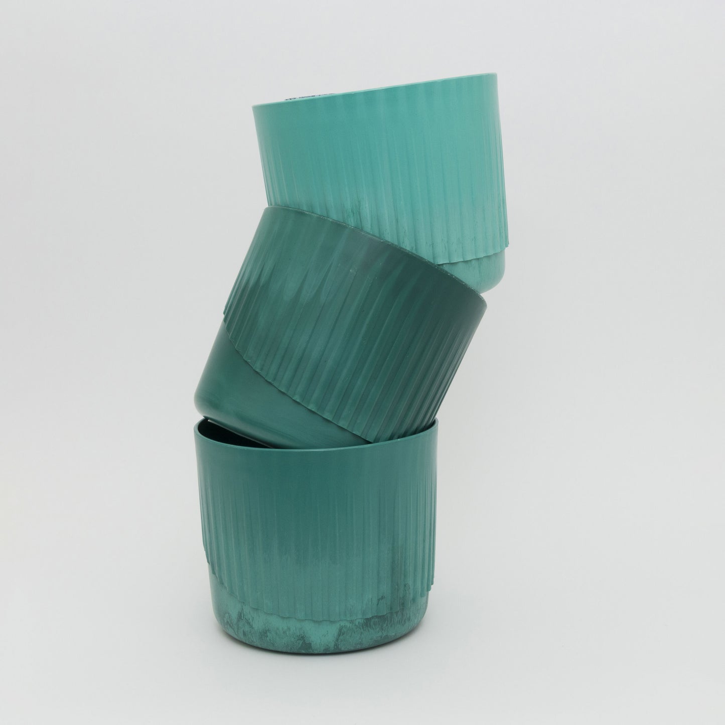 Stack of 3 green plant pots to show colour variation of the green