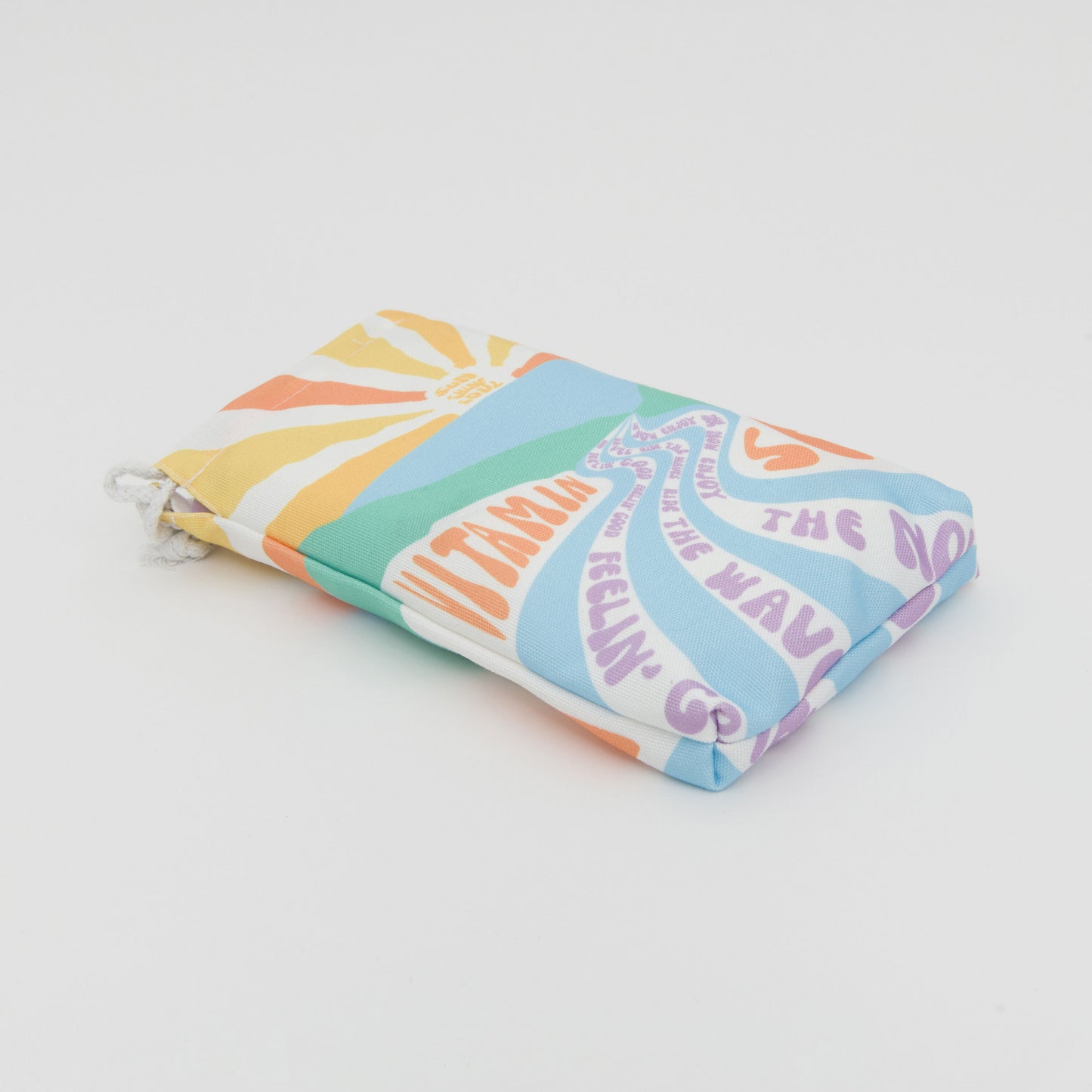 Three quarter length shot of the carry pouch, in pastel colours.
