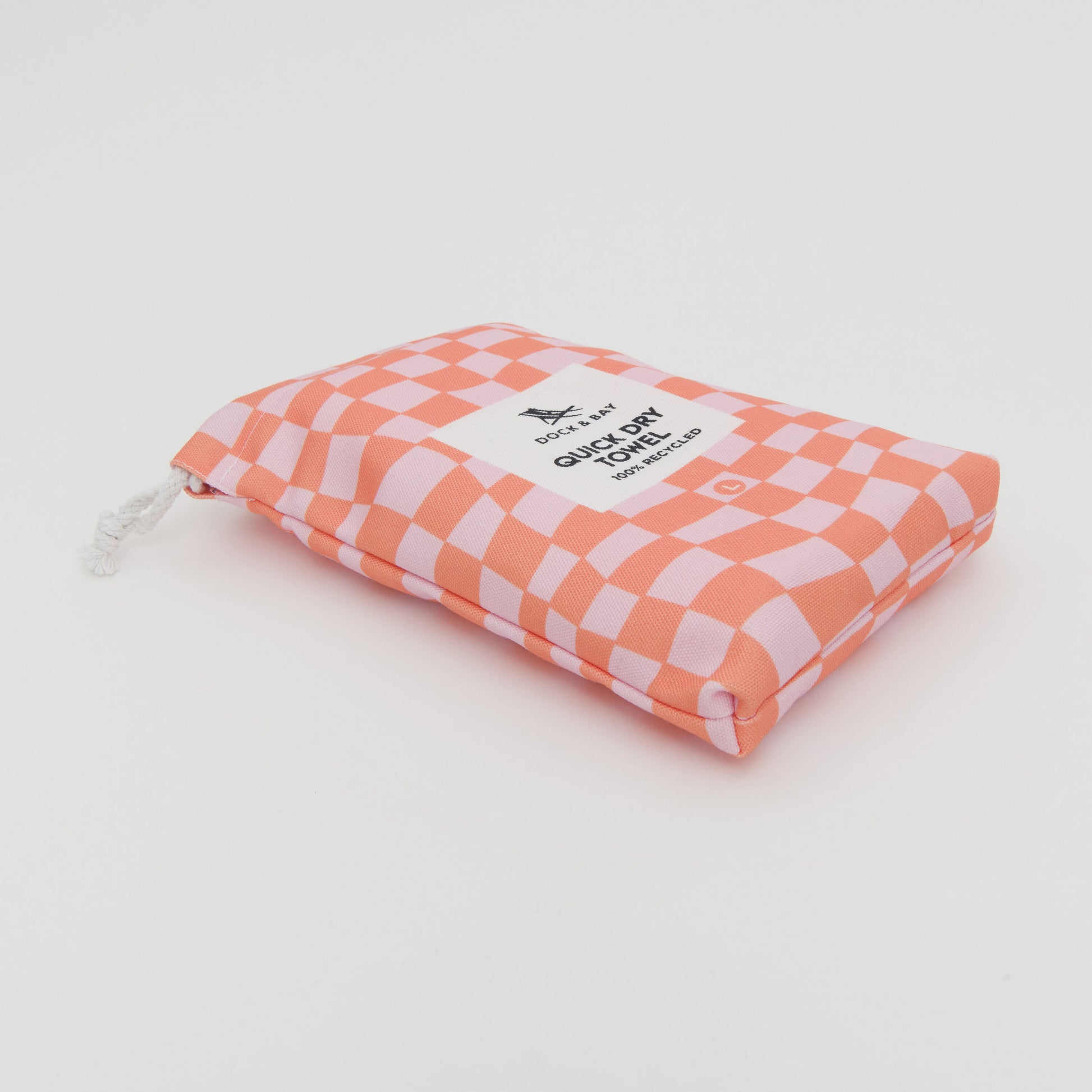 Image of pink and orange bag that the breach towel comes in.