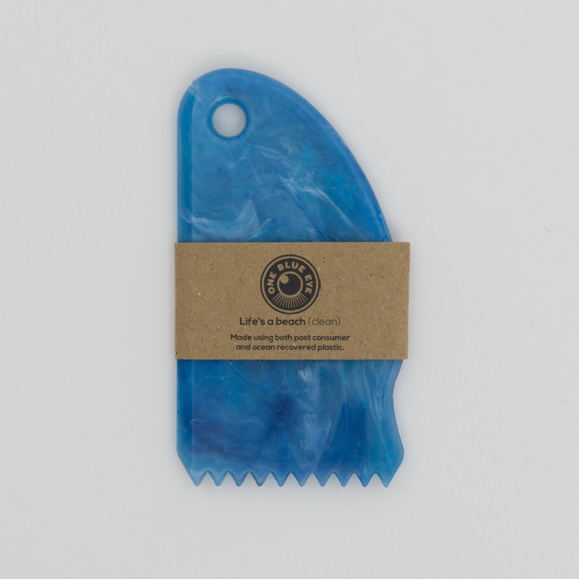 Blue recycled plastic surf wax comb with cardboard packaging