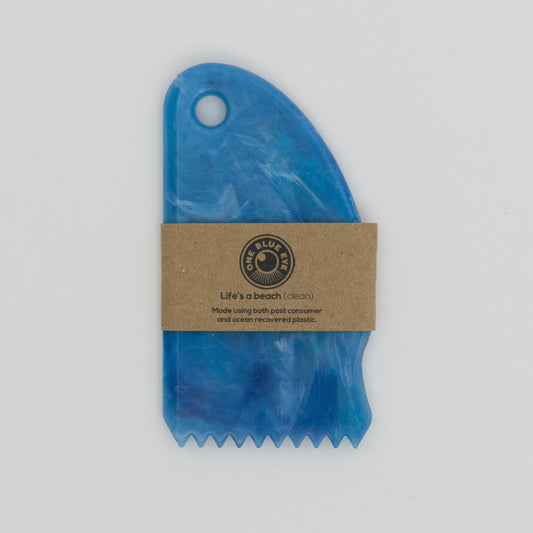 Blue recycled plastic surf wax comb with cardboard packaging