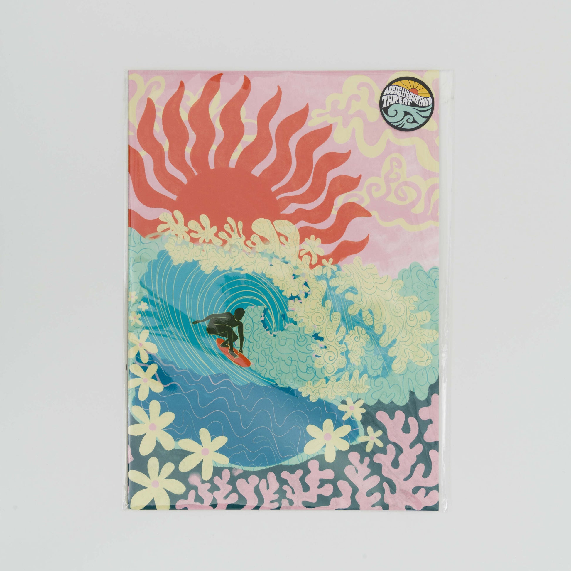 Image of an A4 print showing a surfer riding a big turquoise wave with flowers as foam and coral under the sea. a pink sky with a big red sun in the background.