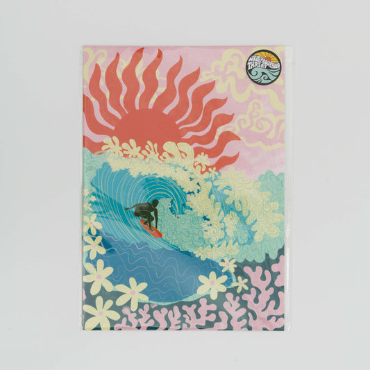 Image of an A4 print showing a surfer riding a big turquoise wave with flowers as foam and coral under the sea. a pink sky with a big red sun in the background.