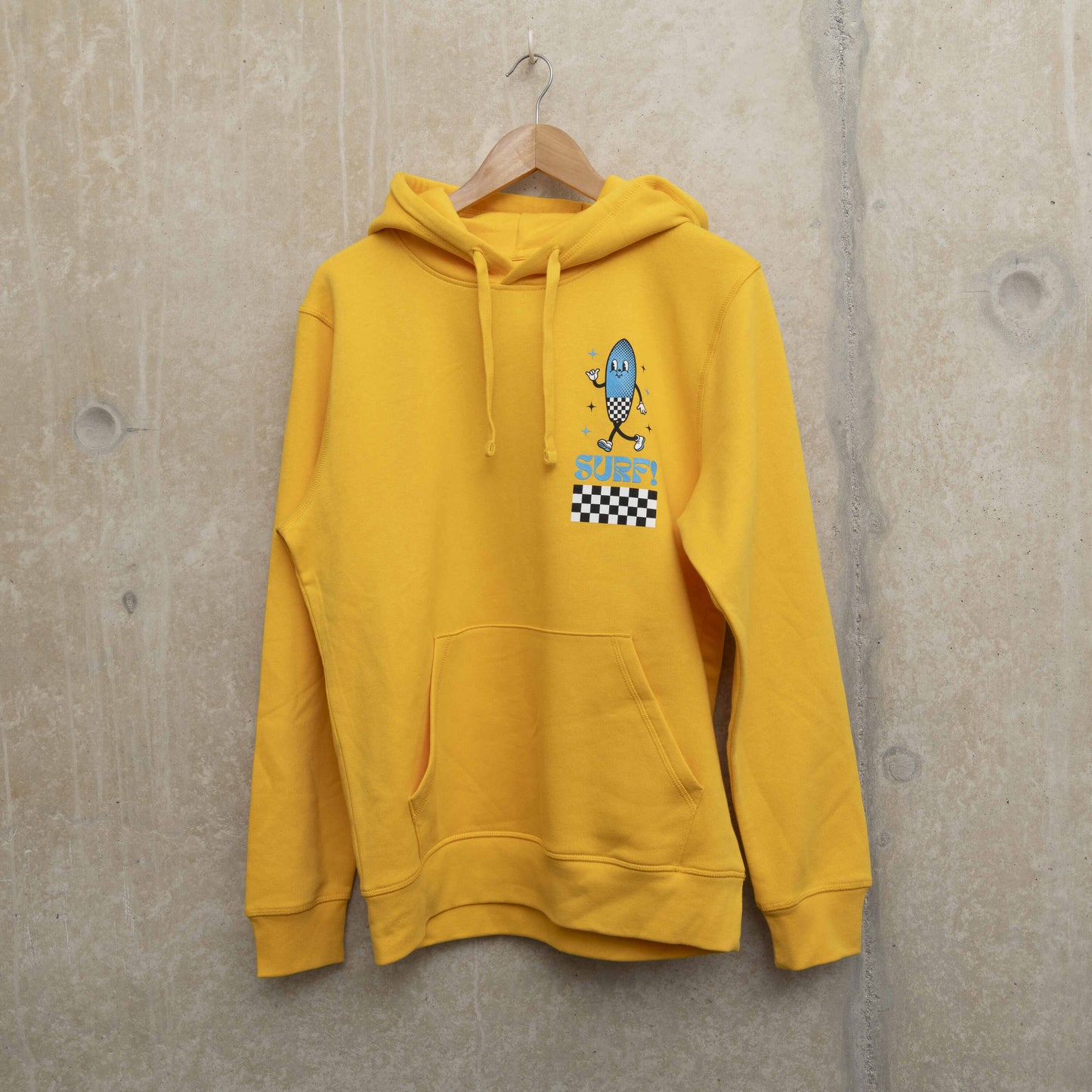 Front shot of bright yellow hoodie with character printed on left chest. Character is shaped like a surfboard in blue with black and white checkerboard design, with the word Surf underneath.