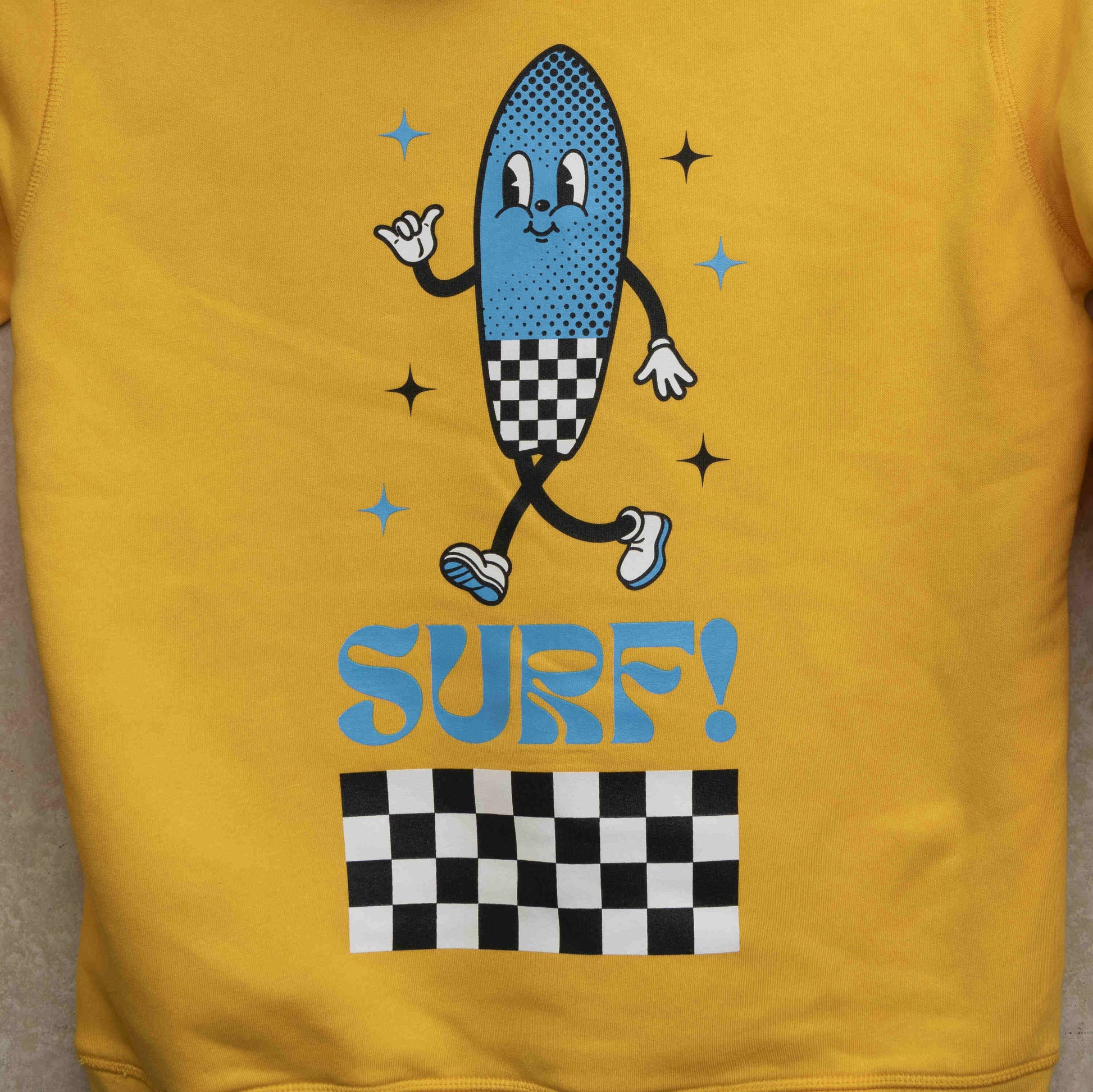 close up of the large printed character on the back of the yellow hoodie.