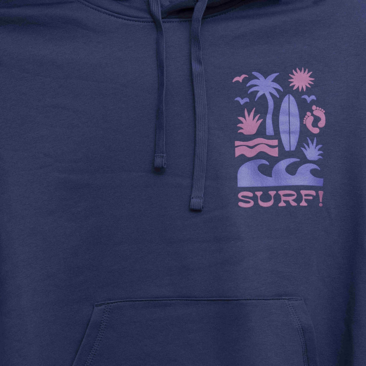 Close up of surf motif in light purple and pink on left chest. Motif shows waves, foot prints, surfboard, sun and palm tree.