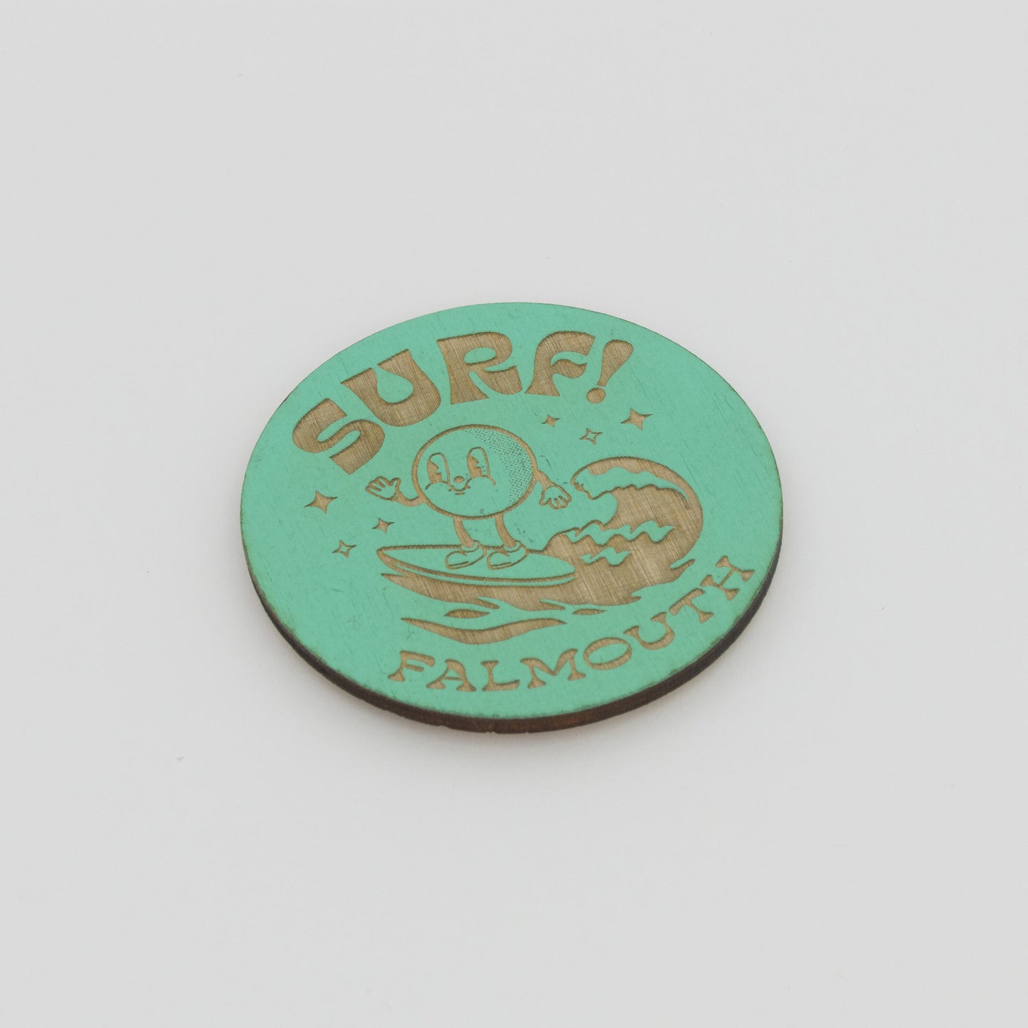 Green Surf Falmouth magnet with little character riding a wave