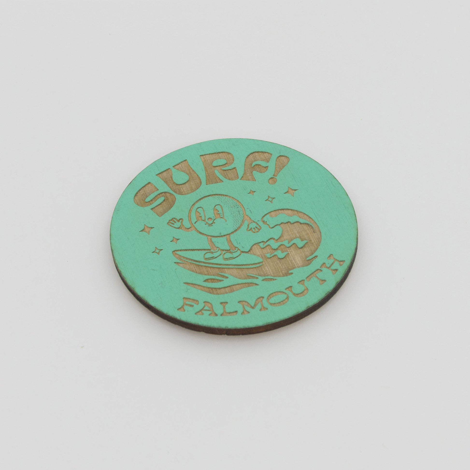 Green Surf Falmouth magnet with little character riding a wave