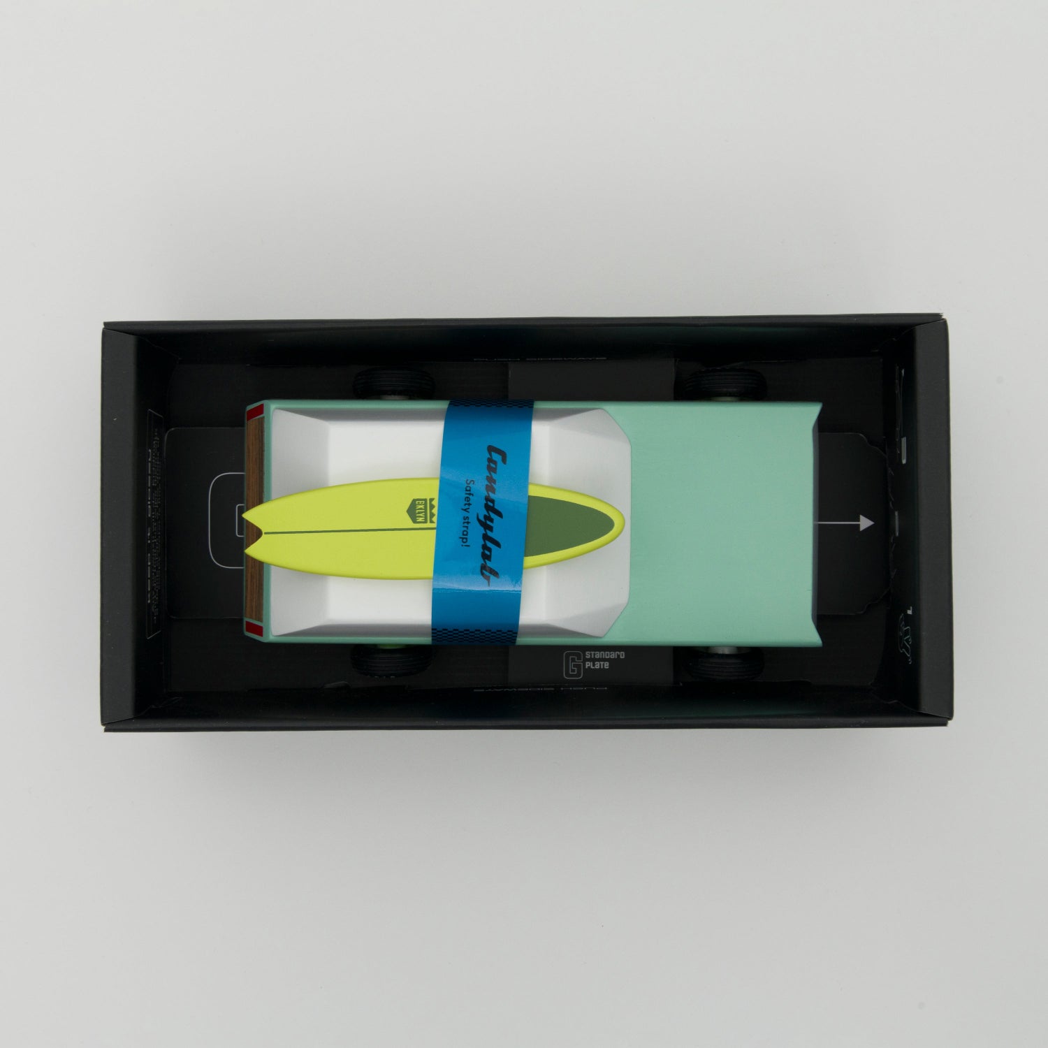 Shot of the car inside its box looking down from above.