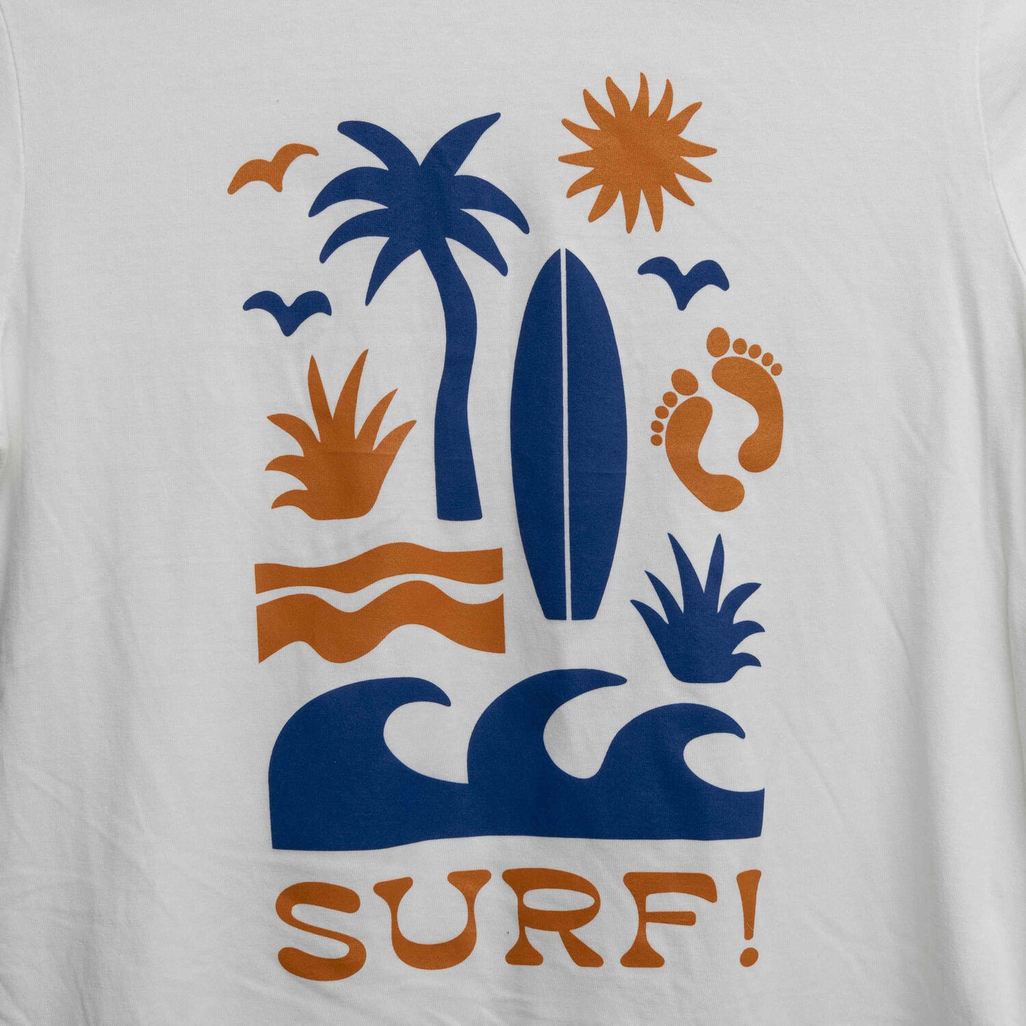 Close up view of the the Surf motif. Motif shows waves, foot prints, surfboard, sun and palm tree.