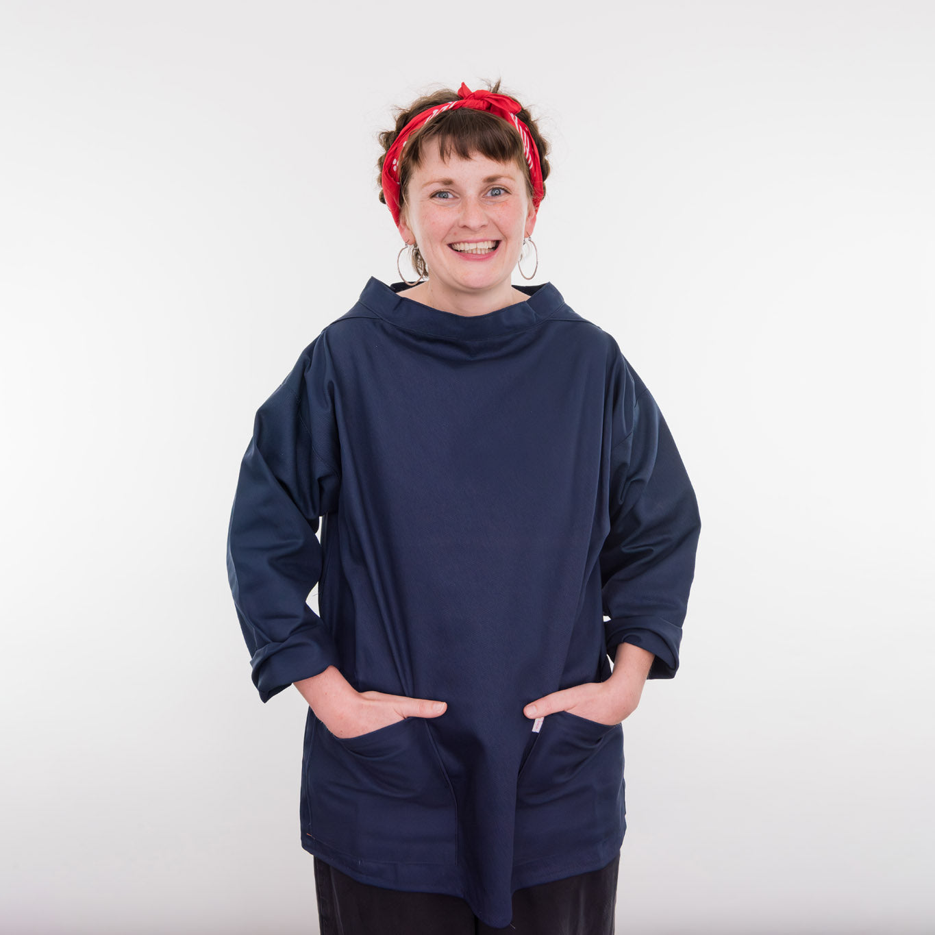 A man wearing the blue smock.