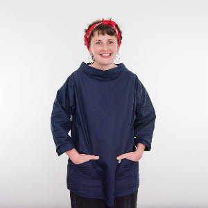 A woman wearing the blue smock.