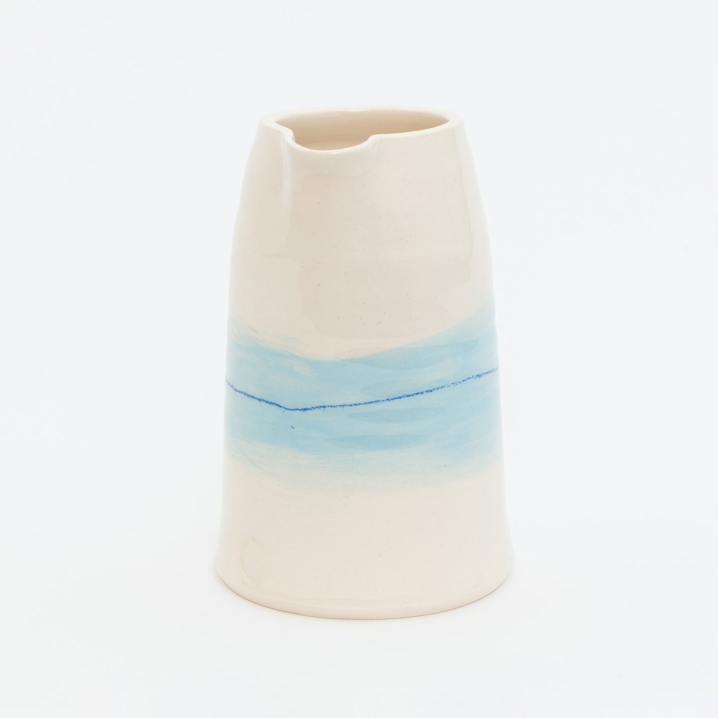 Ceramic vase with a gradient from beige to blue on a white background