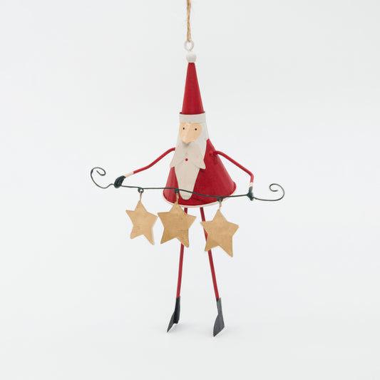 Decorative Santa Claus figure holding stars on a white background