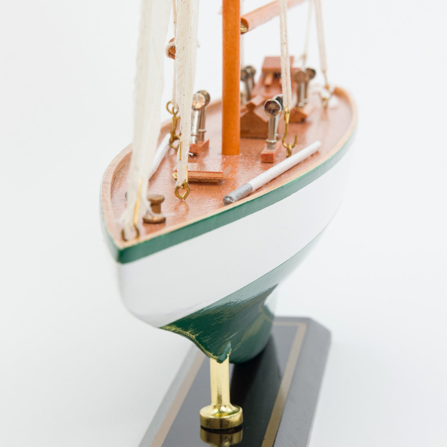 Model sailboat on a white background