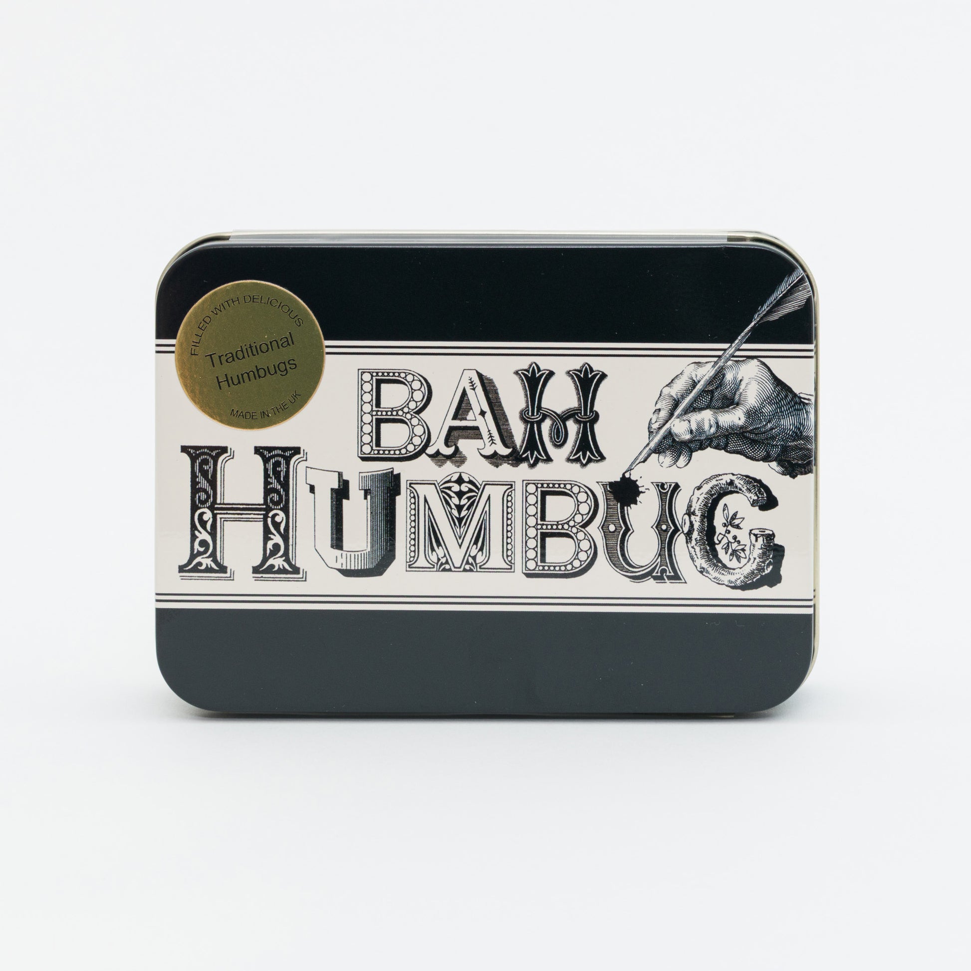 Tin box with 'Bah Humbug' text and a gold label on a white background