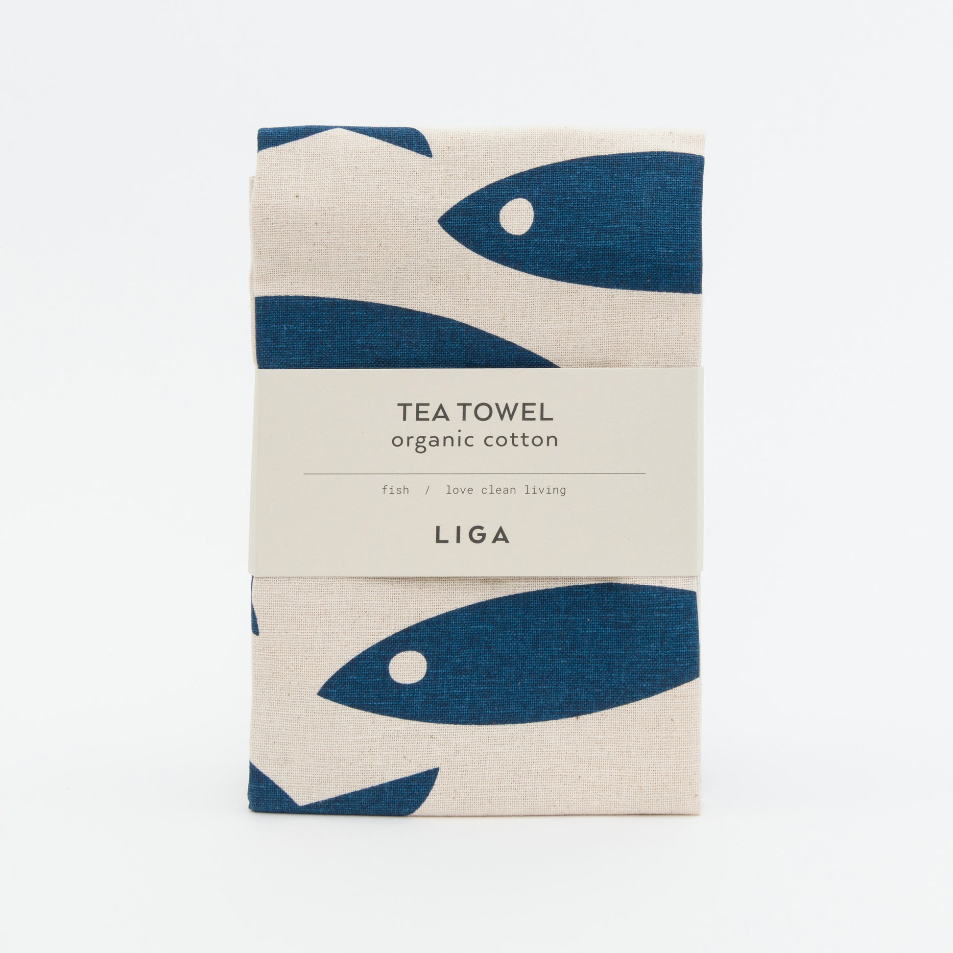 Tea towel with dark blue fish design on a creamy white background.