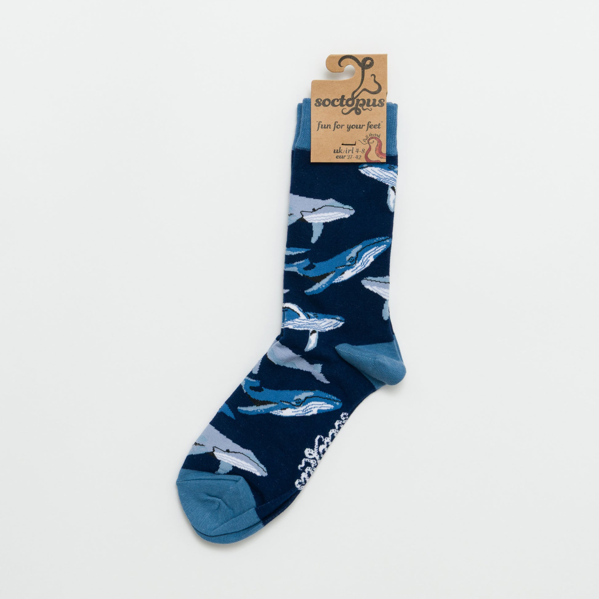 Navy sock with shark pattern photographed against a white background.