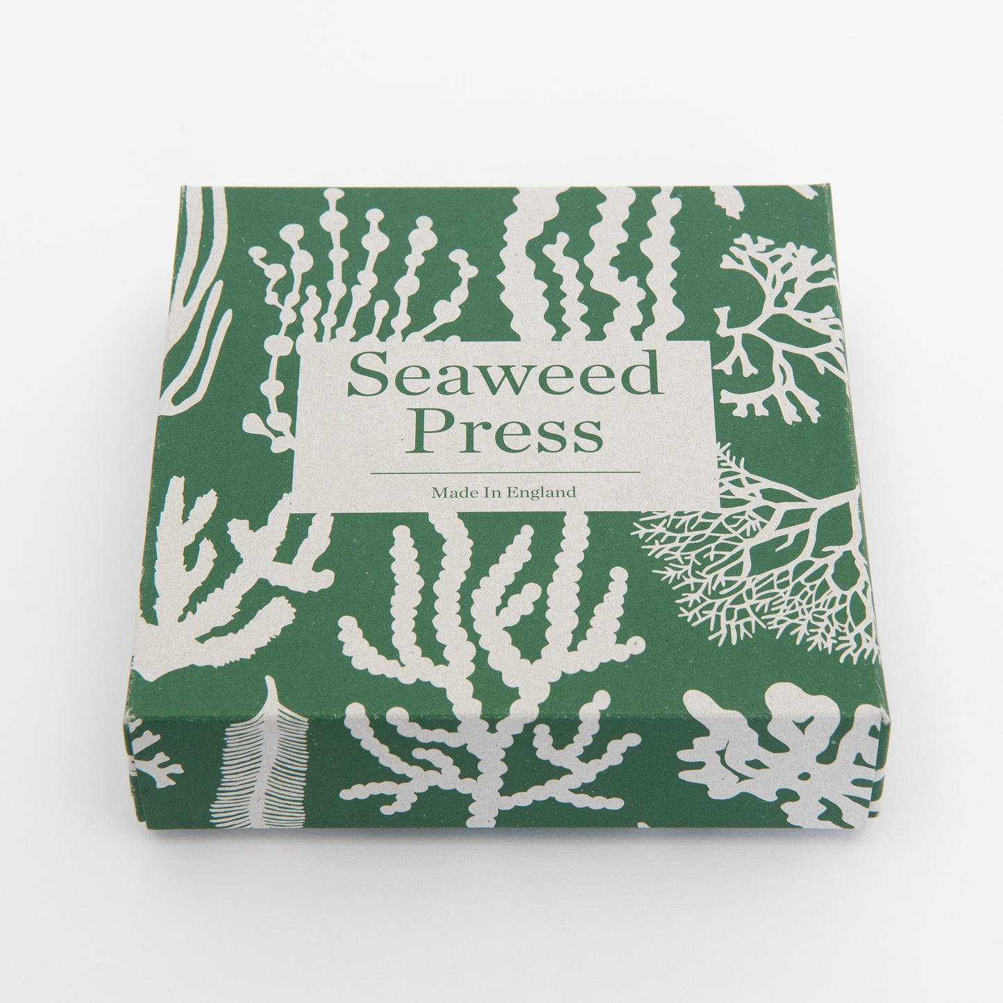 A low angle shot of the packaging in green and beige
