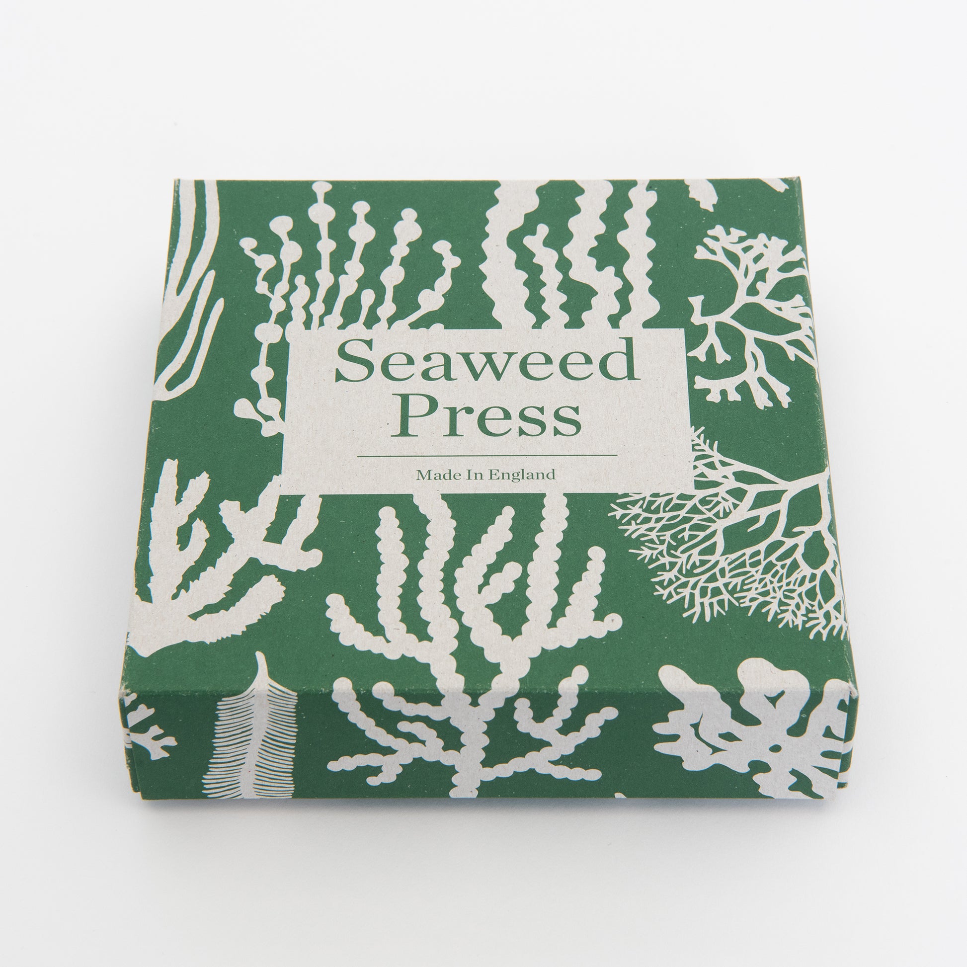 A low angle shot of the packaging in green and beige