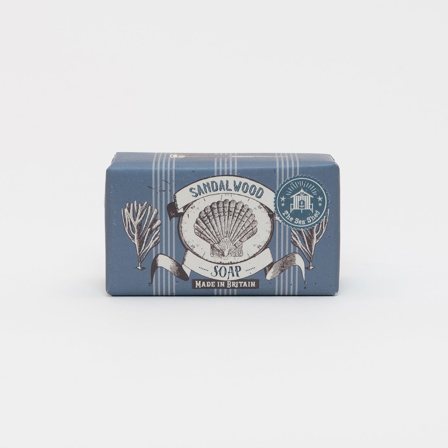 Packaged Cornish Sandalwood Soap on a white background. The packaging is dark blue with illustrations of a shell and seaweed.