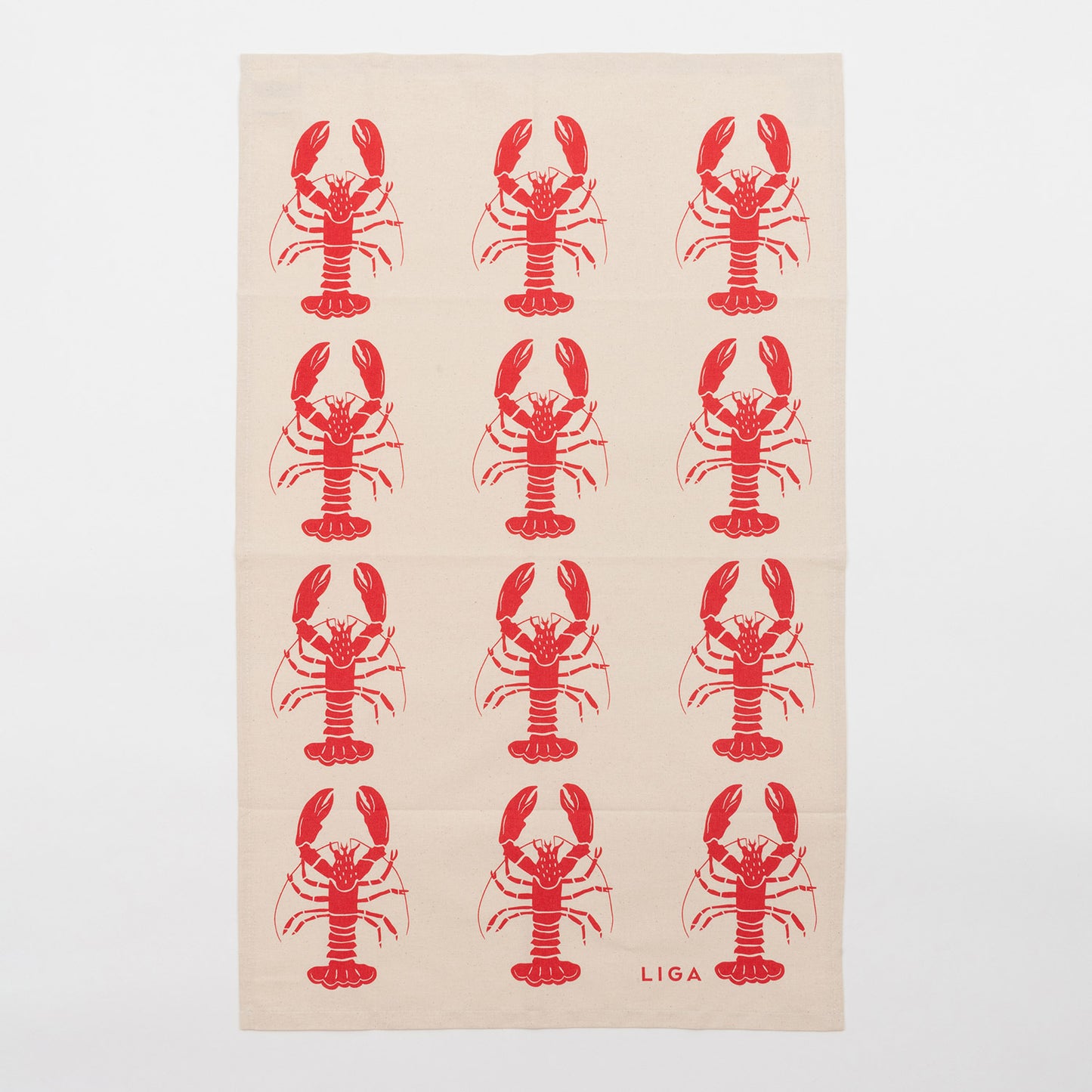 Red lobster repeating pattern on a cream coloured back ground. The Red Lobster Tea Towel in on a white background.