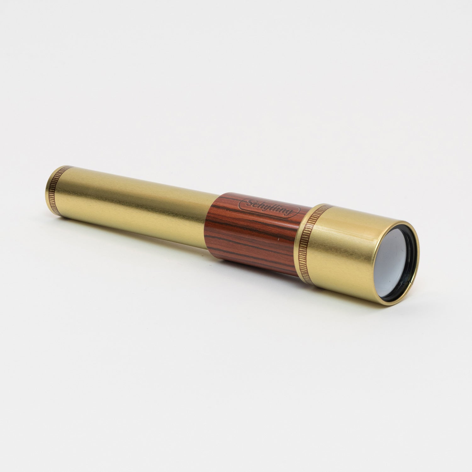 A tin toy telescope pictured on a white background.
