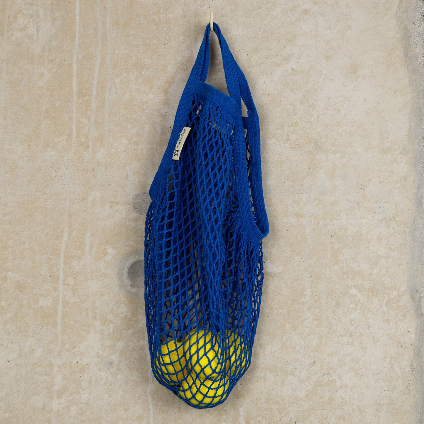 blue string shopping bag with short handles