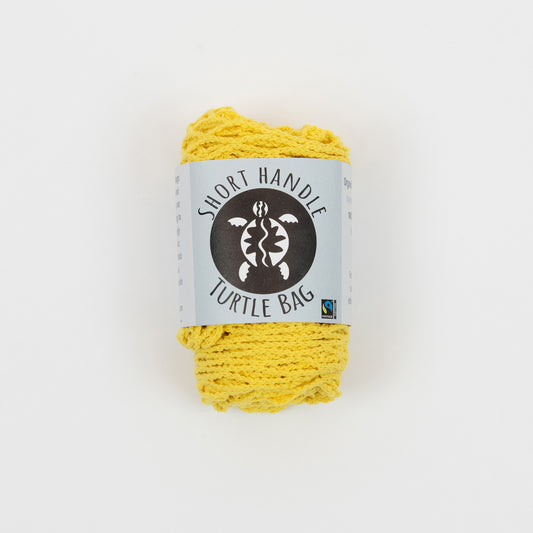 Yellow string bag in packaging