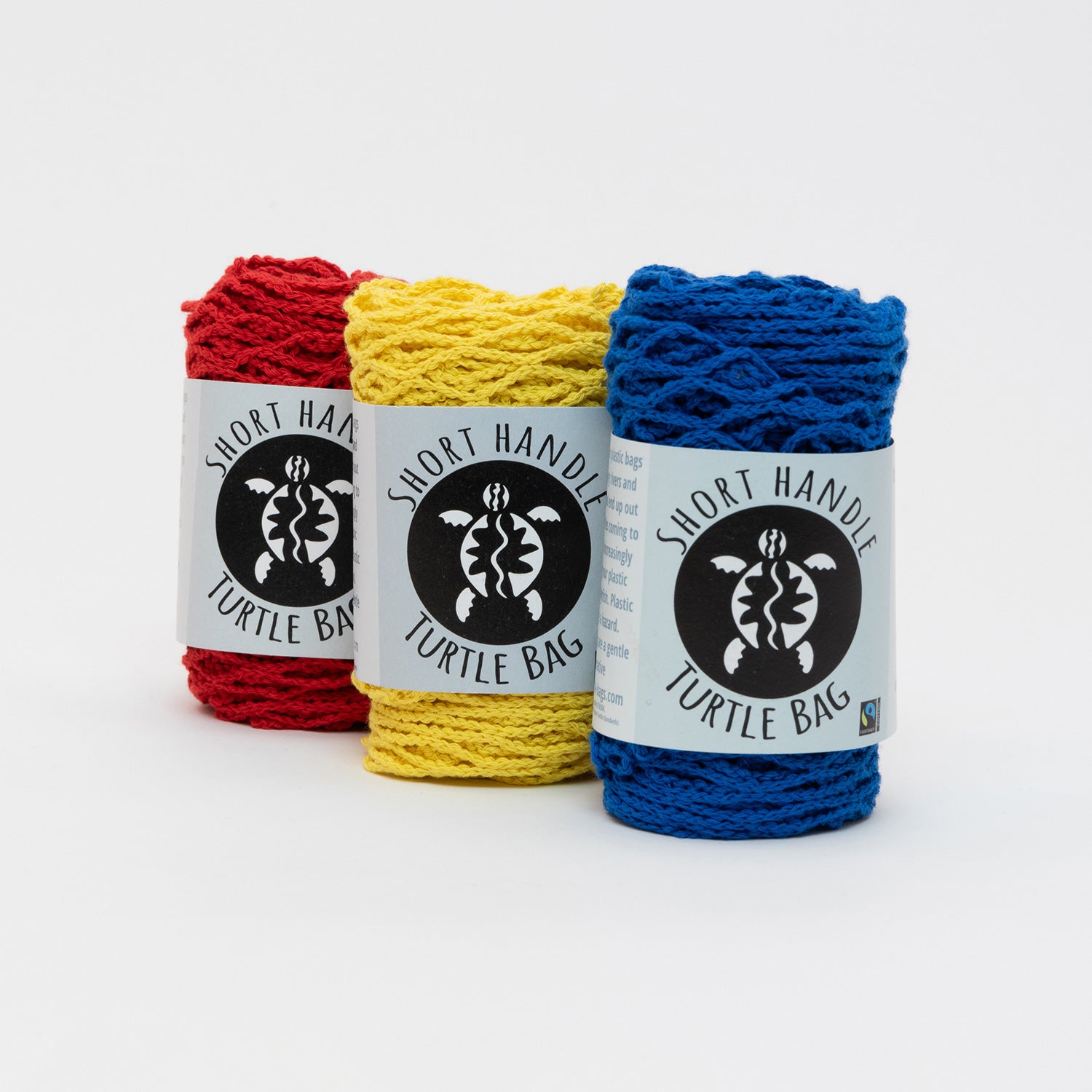 Red, blue and yellow string bags in packaging