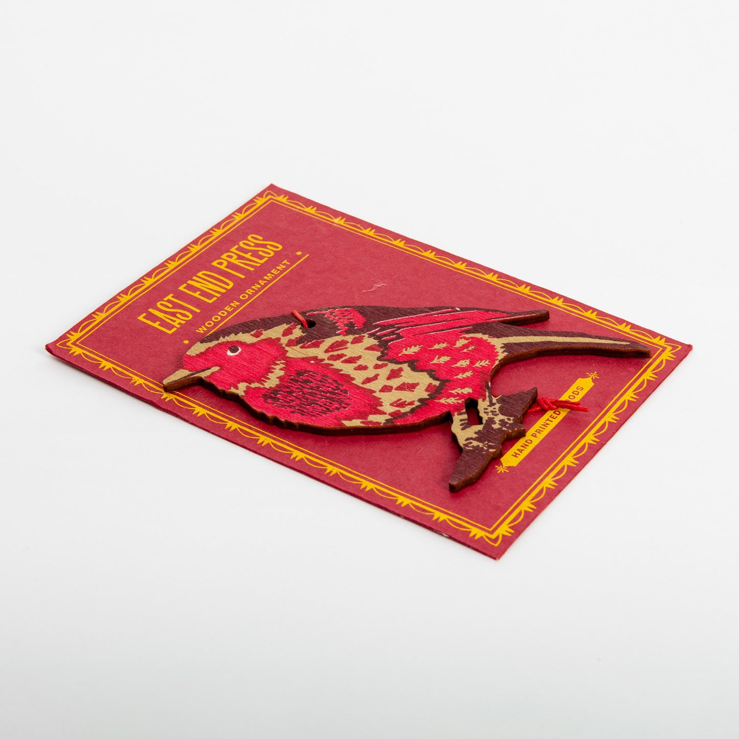 Side shot of red and maroon wooden robin