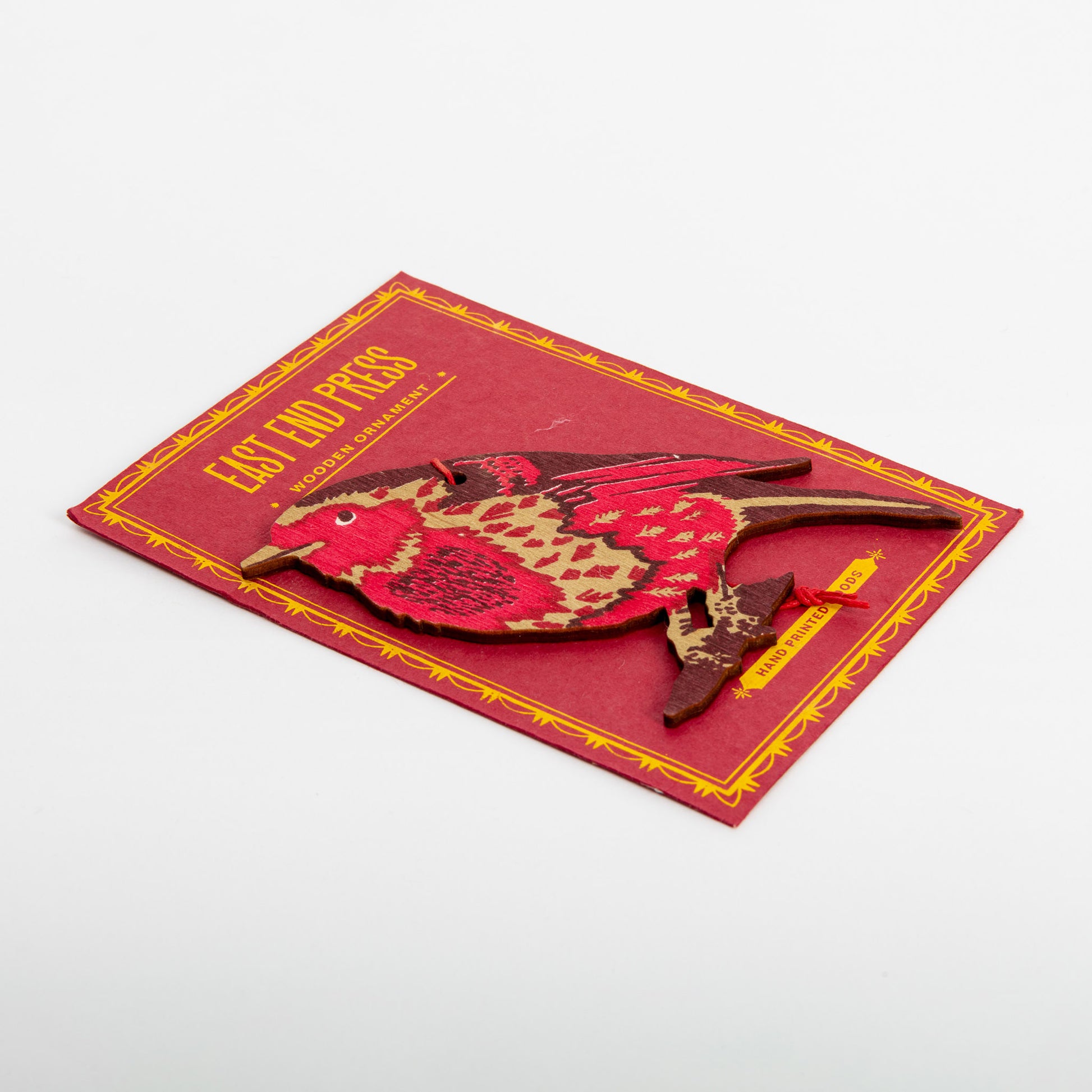 Side shot of red and maroon wooden robin