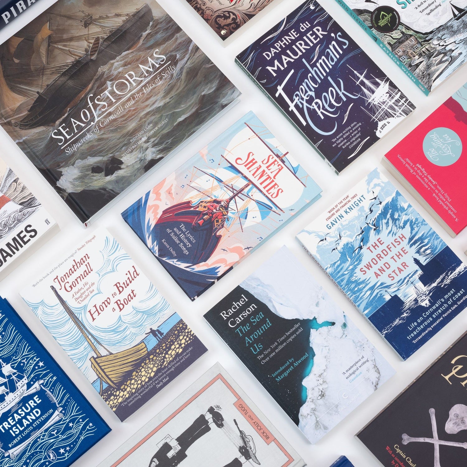 A photo of a collection of maritime-themed books pictured on a white table.
