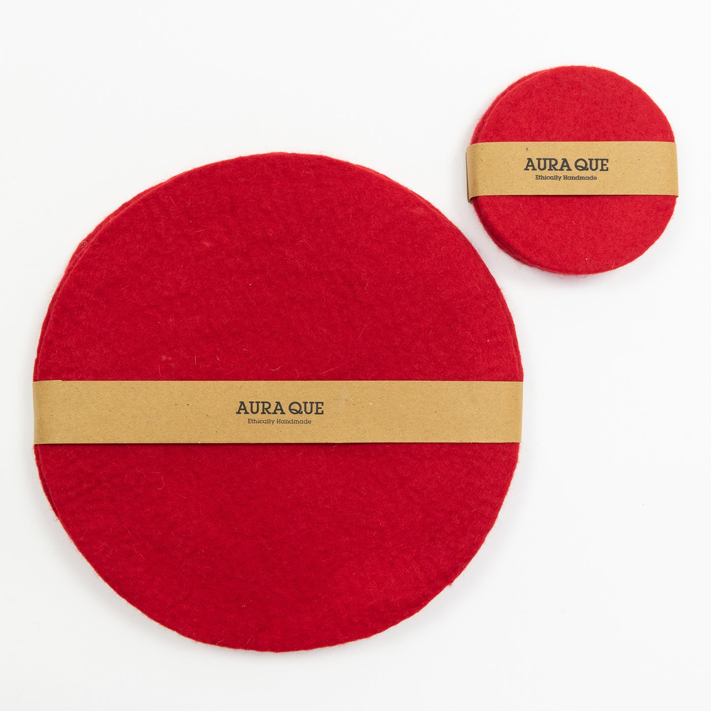 A set of red felt table mats and coasters pictured on a white background.