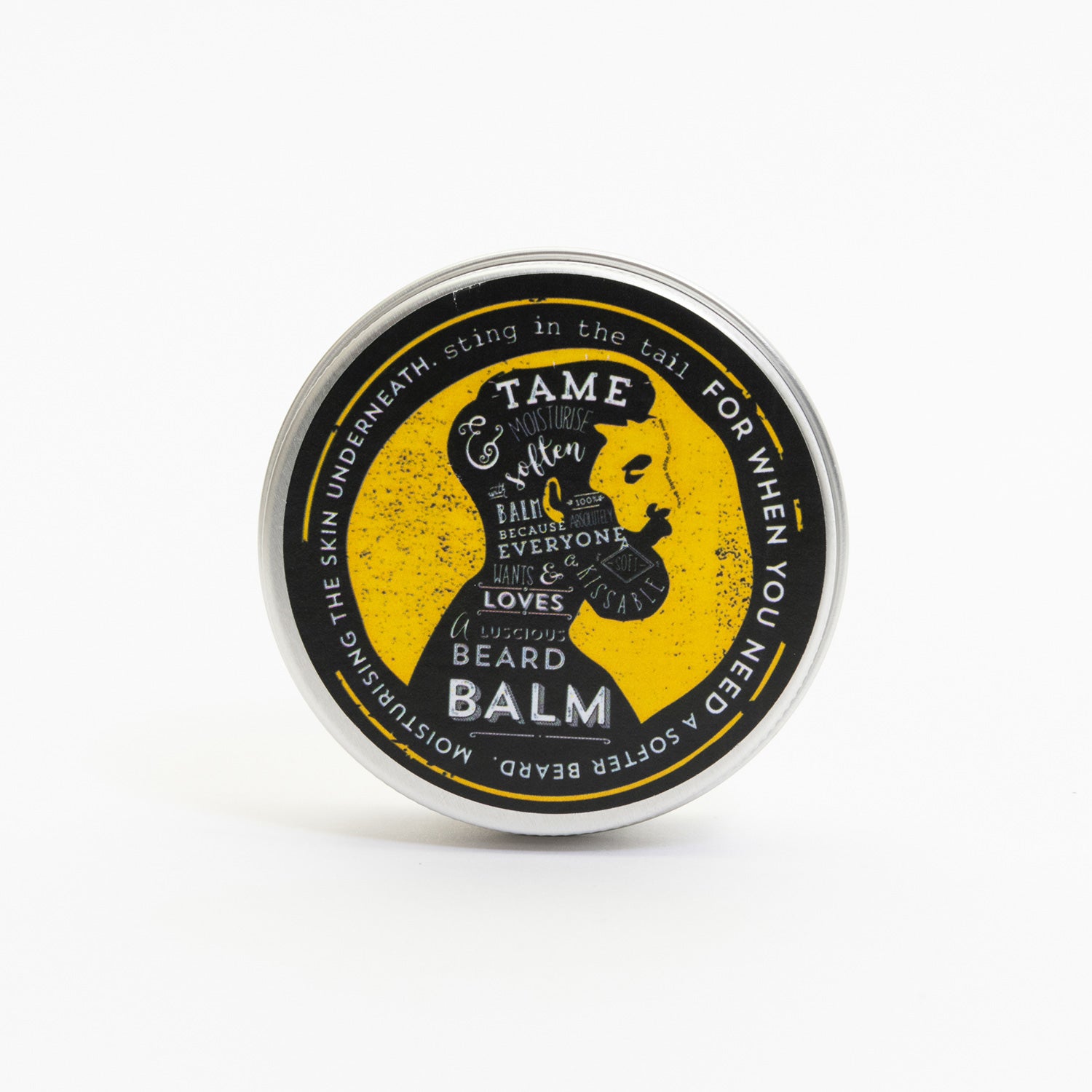 A tin of beard balm pictured on a white background. The tin has a yellow and black label featuring an illustration of a man in profile with a thick beard.