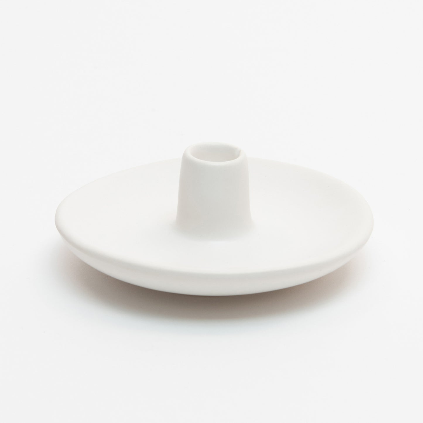 St Eval Mini Candle Holder. Small ceramic white dish with holder protruding up from centre.