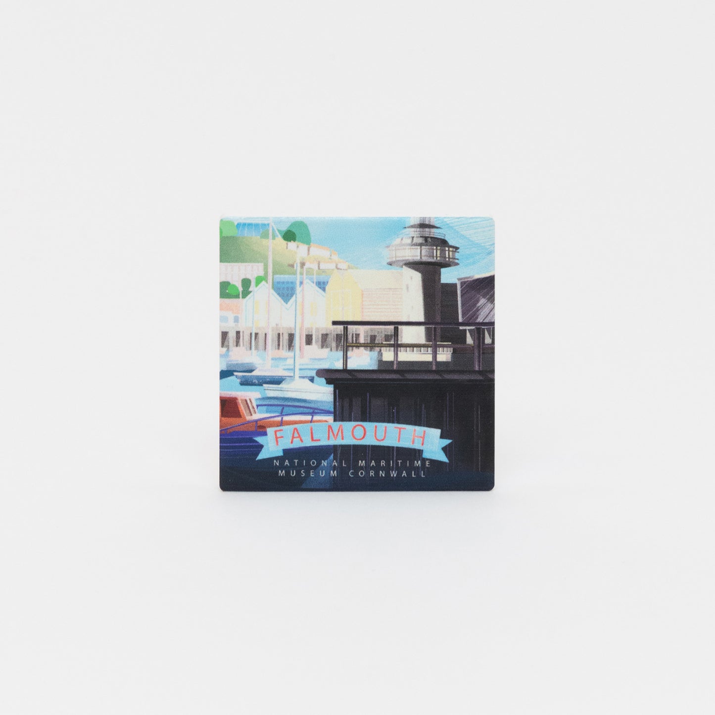 A top-down photo of the NMMC magnet on a white background. The magnet features an illustration of National Maritime Museum Cornwall and Falmouth Harbour.