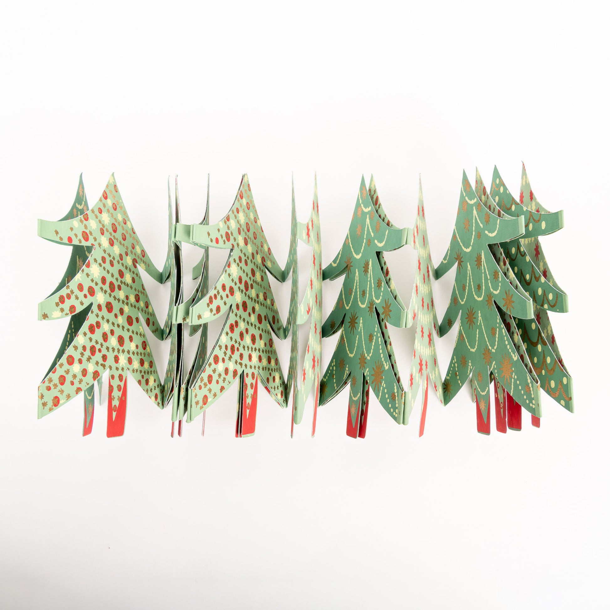 Close up of garland of Christmas trees in light green and dark green with metallic decorations.