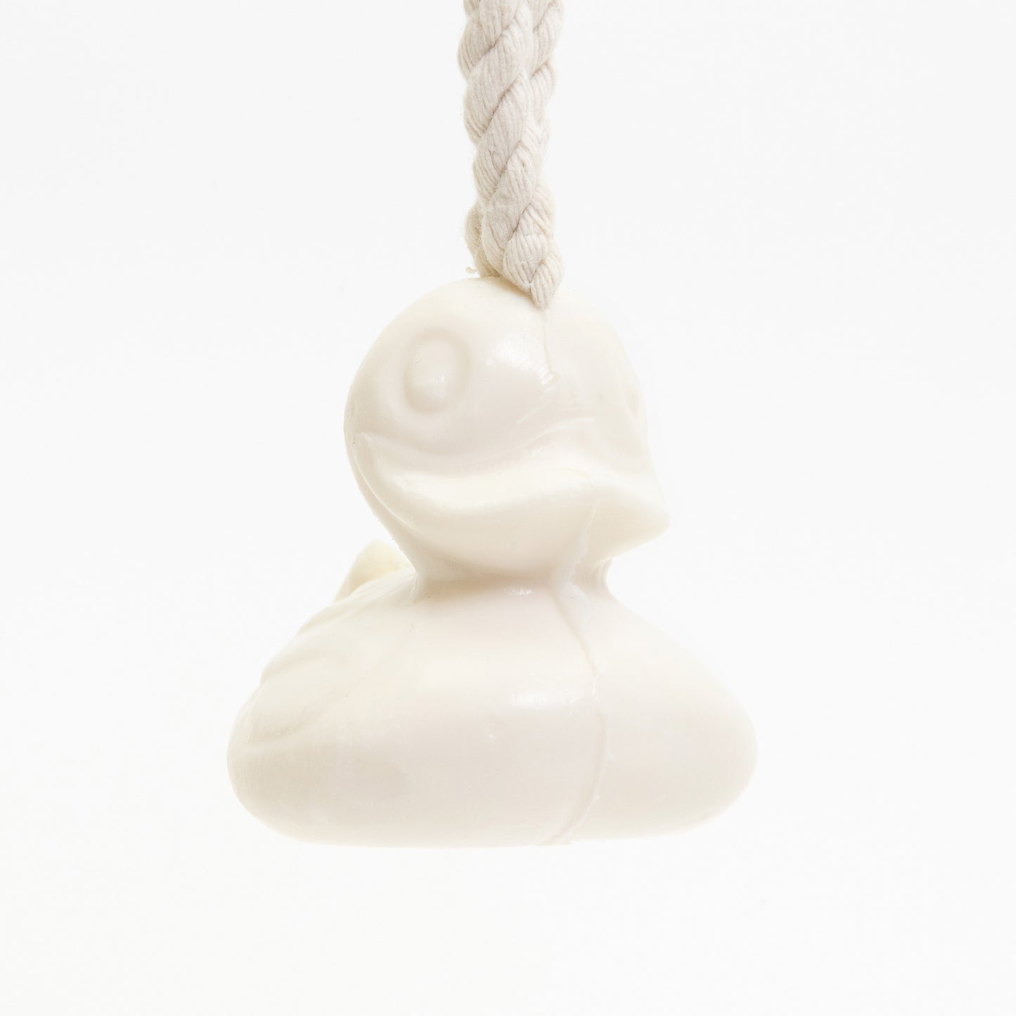 A white duck-shaped soap on a rope, pictured on a white background.