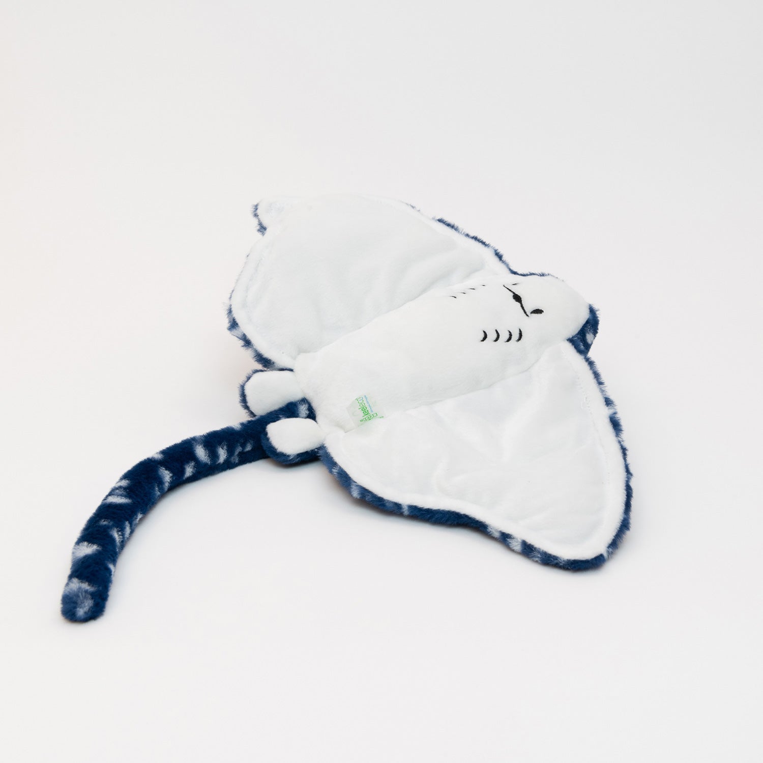 A plush ray soft toy, blue with white spots, pictured on a white background.