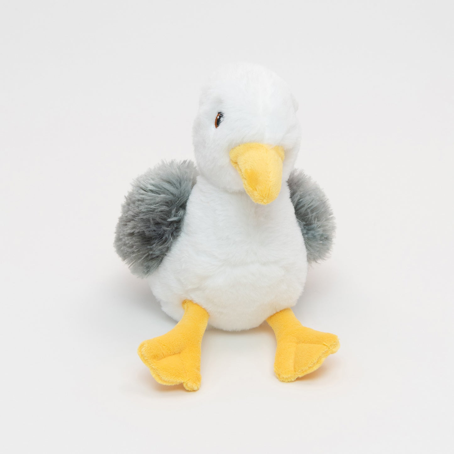 A plush seagull pictured on a white background.