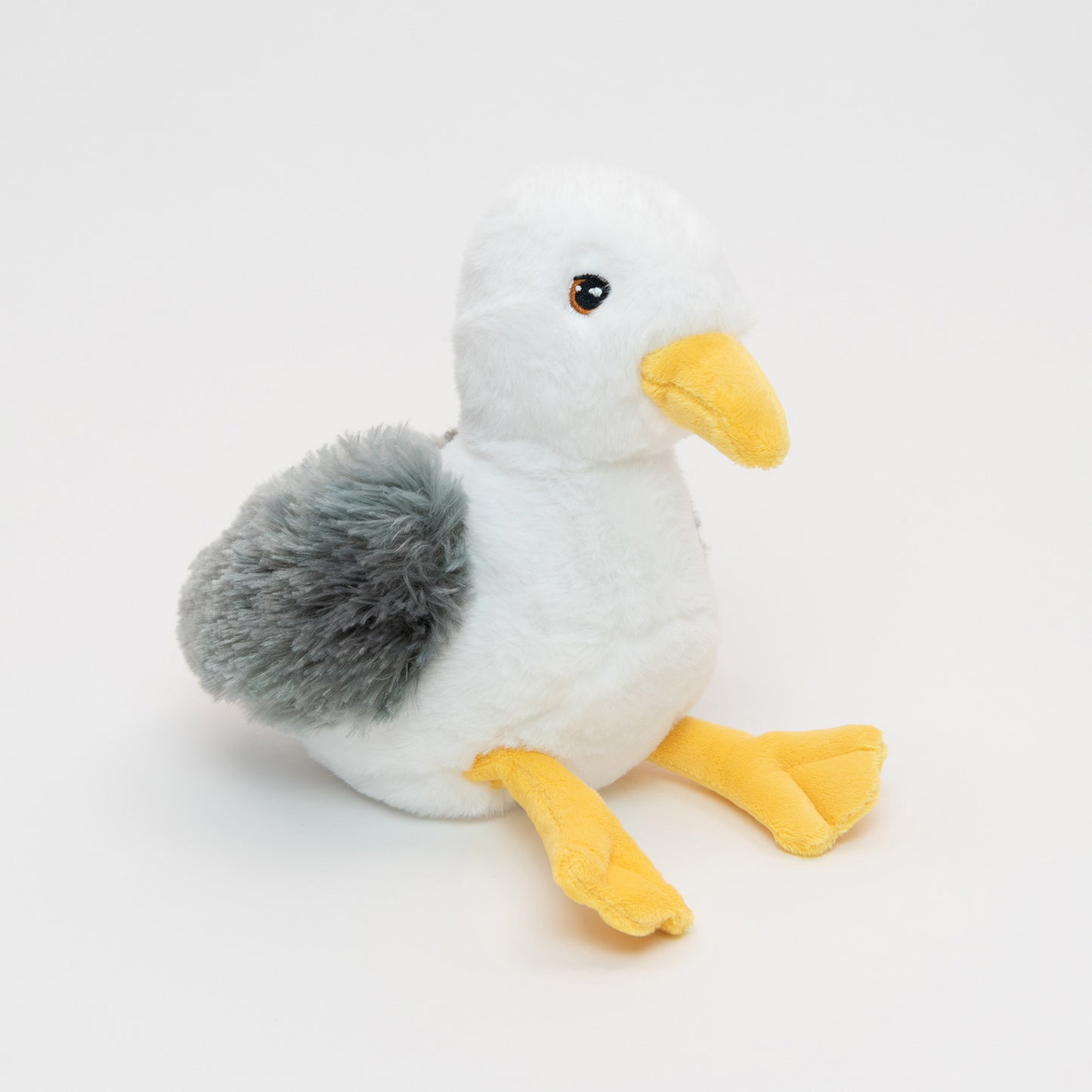 A plush seagull pictured on a white background.